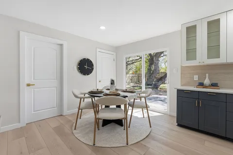 a kitchen with a sink cabinets and stainless steel appliances