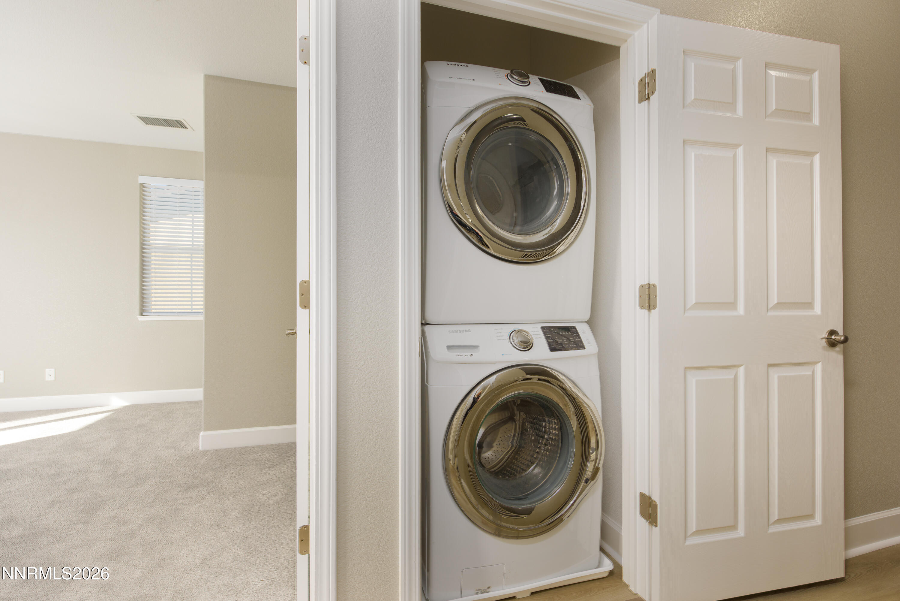 1221 Fonterra Way Carson City, NV 89701 - Photo 14 of 27 a view of a hallway with washer and dryer