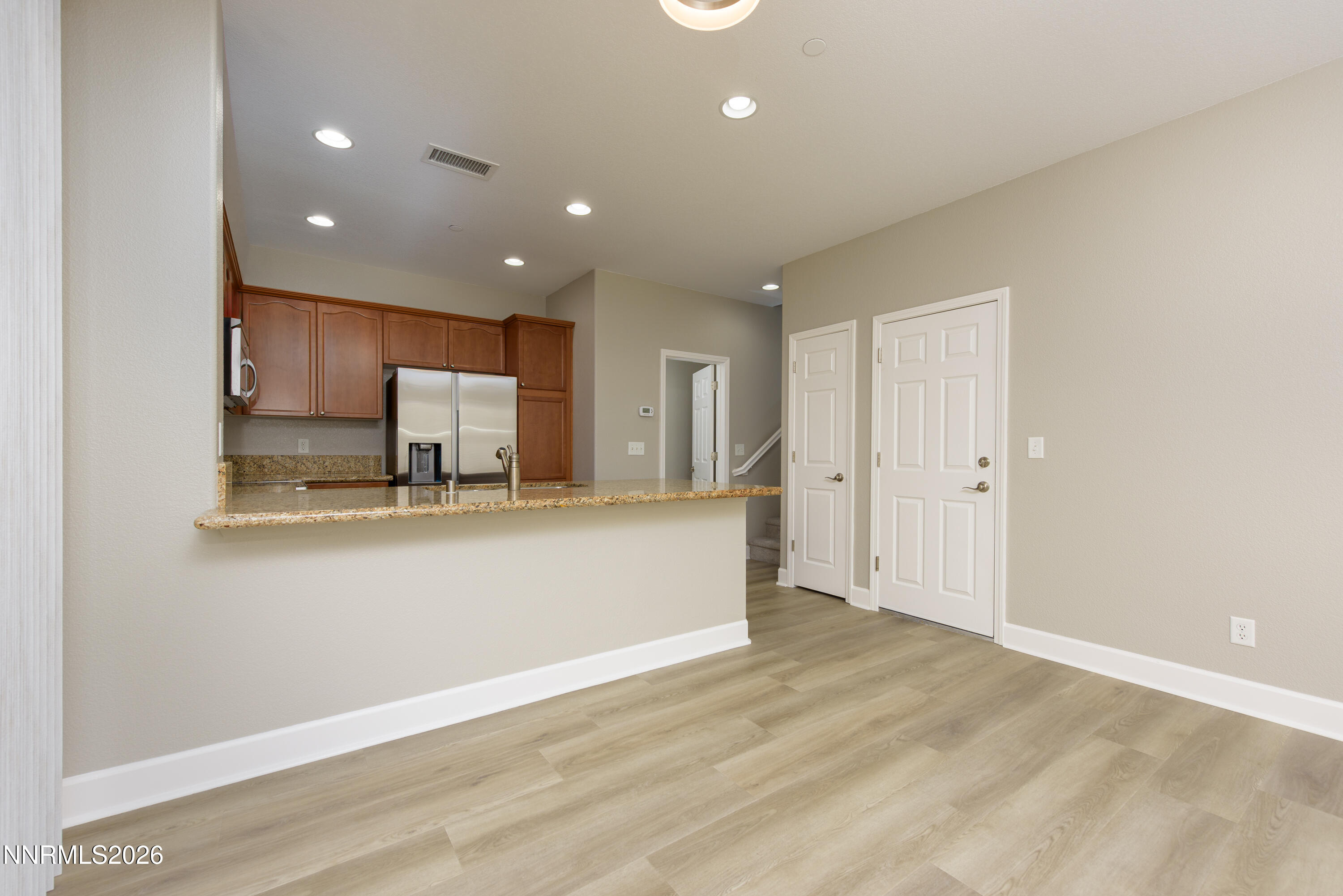 1221 Fonterra Way Carson City, NV 89701 - Photo 6 of 27 a view of kitchen with stainless steel appliances granite countertop cabinets and wooden floor