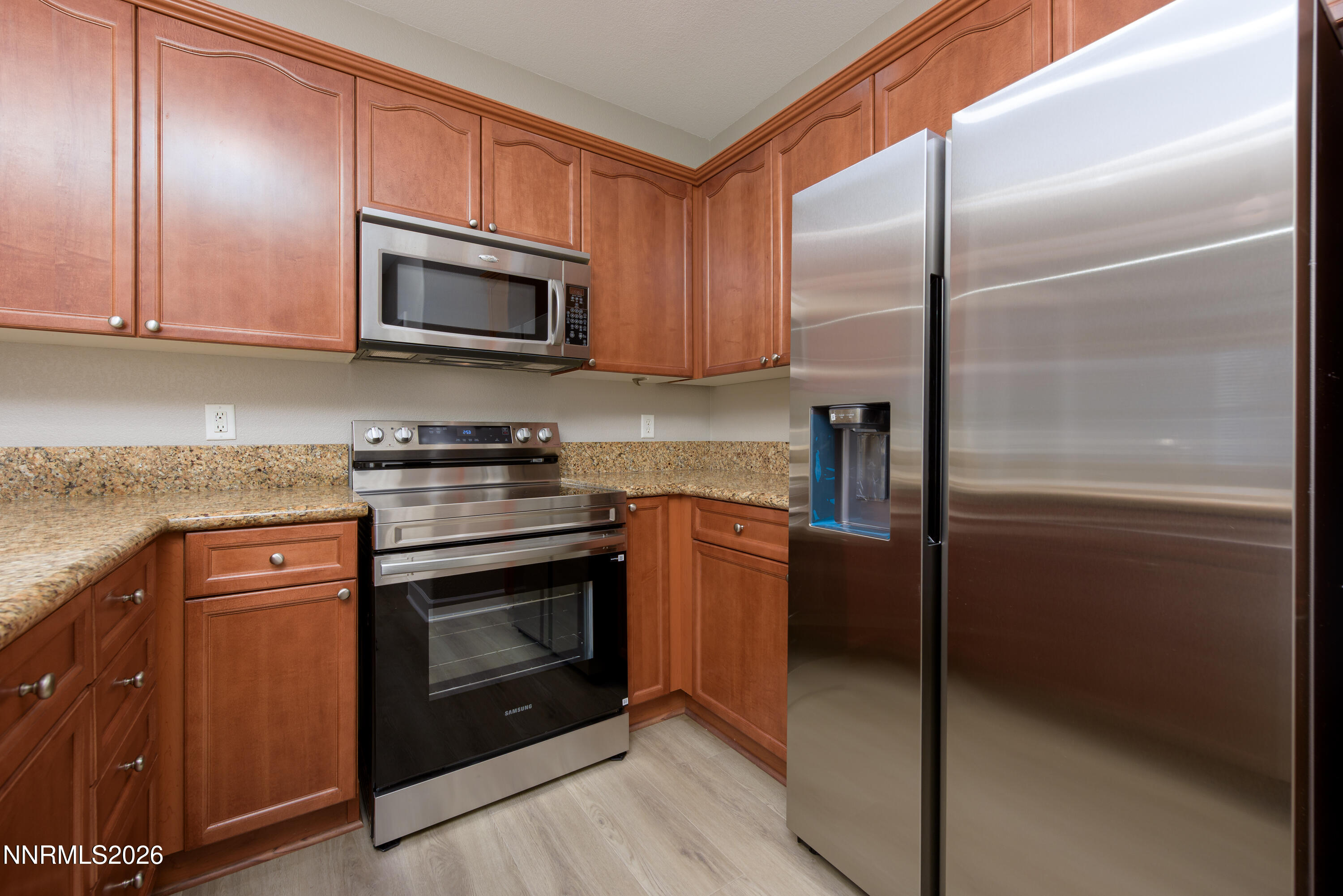 1221 Fonterra Way Carson City, NV 89701 - Photo 8 of 27 a kitchen with a refrigerator stove and microwave