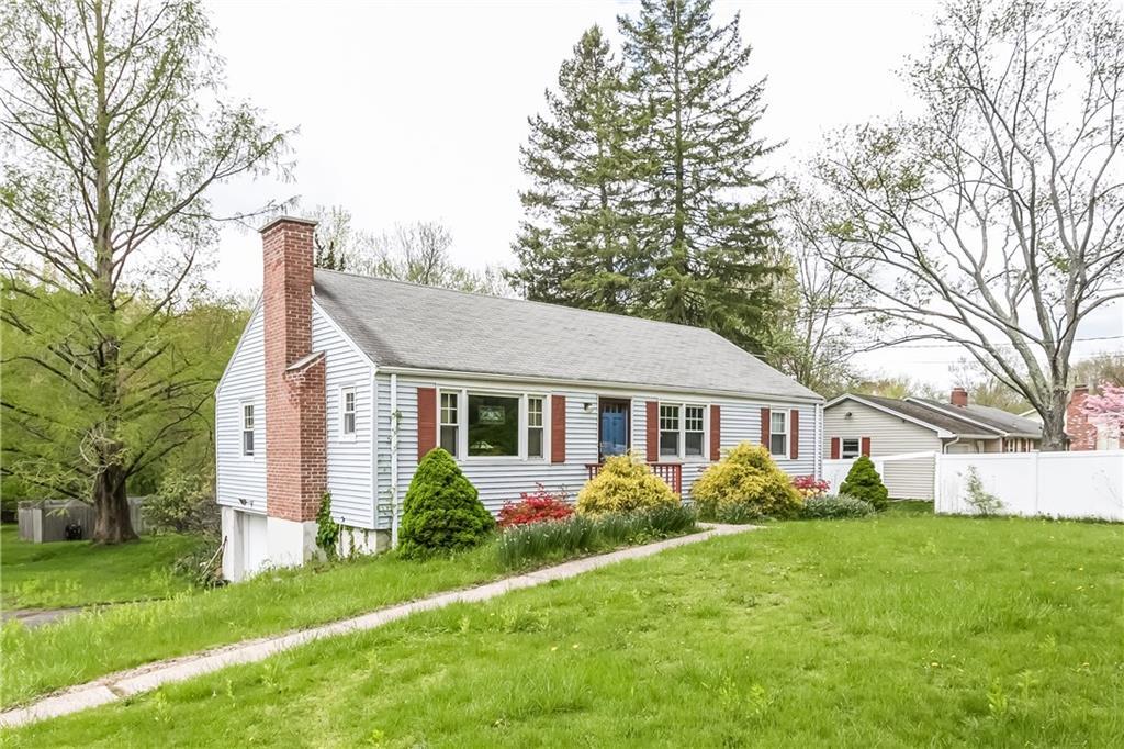 44-2 2 Mile Road Farmington, CT 06032 - Photo 1 of 1 a front view of house with yard and green space