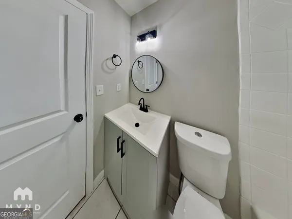 a bathroom with a toilet and a sink