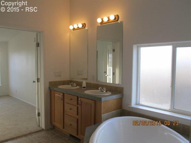 21376 County Road South, Unit 2 Rush, CO 80833 - Photo 2 of 17 Master bath with double sinks and corner soaking tub