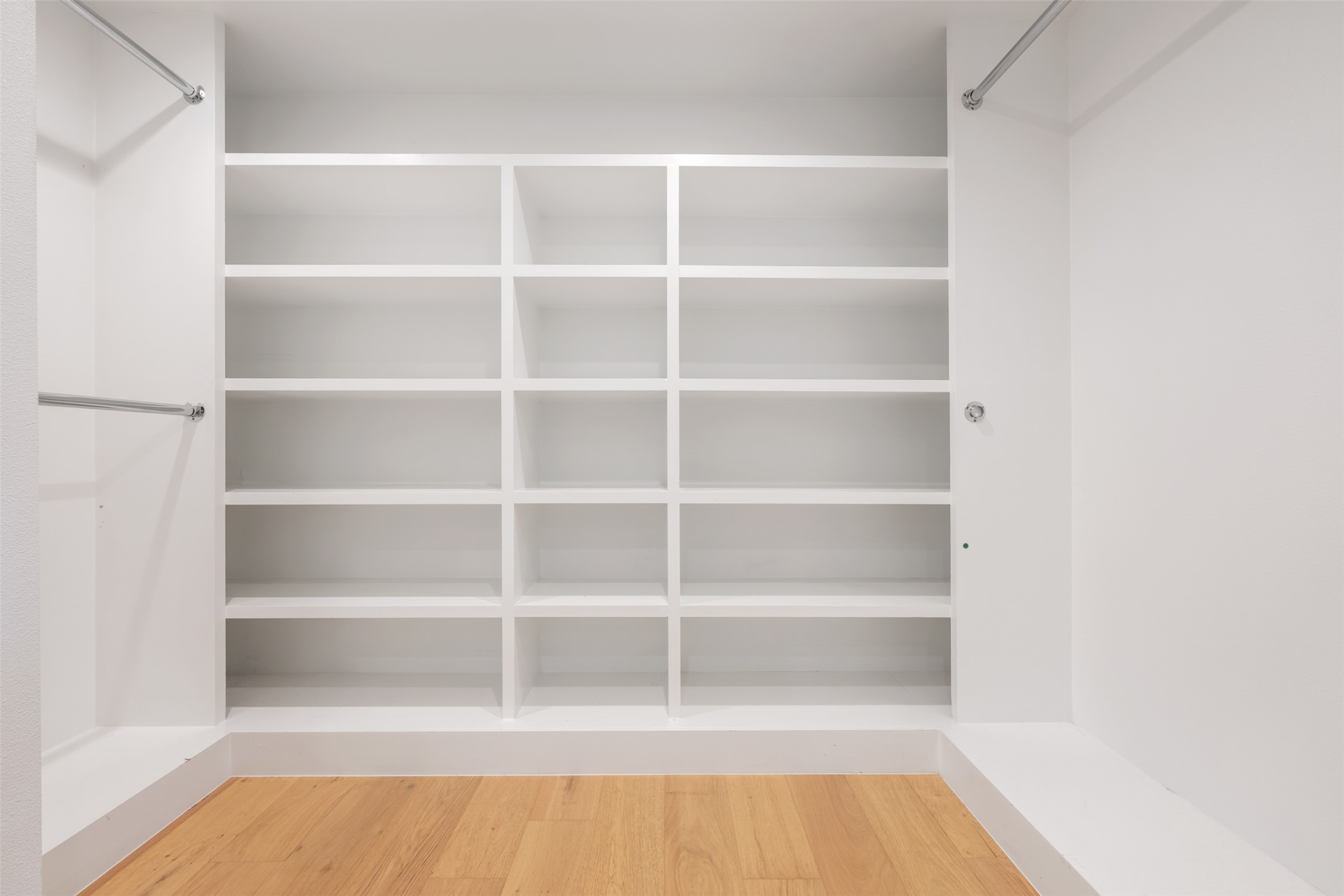 8900 Point W Drive Austin, TX 78759 - Photo 27 of 40 Ample shelving and hanging rods provide versatile storage in this well-appointed walk-in closet.