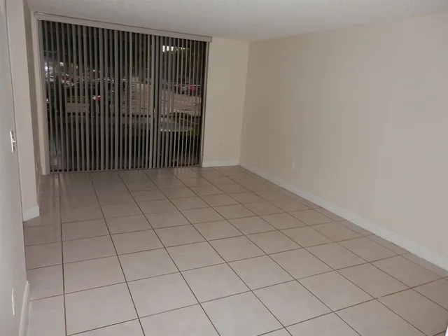 a white refrigerator freezer sitting inside of a kitchen