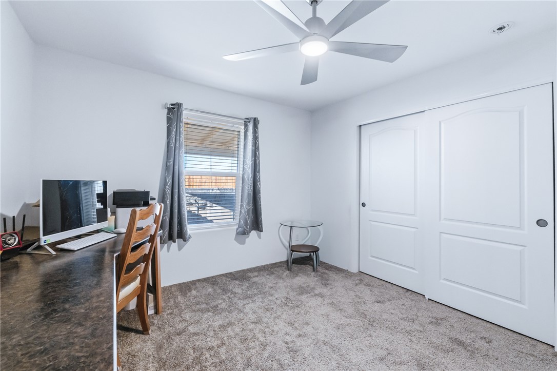 429 South Lochiel Road Golden Valley, AZ 86413 - Photo 33 of 61 Home office with light colored carpet and ceiling fan