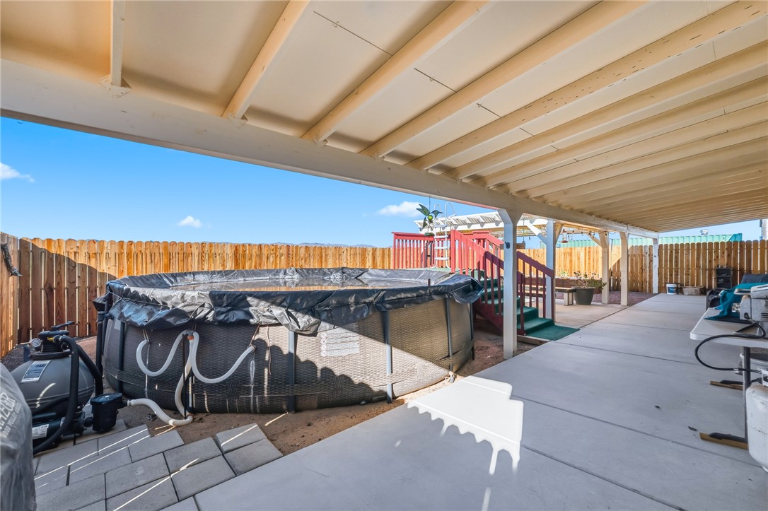 429 South Lochiel Road Golden Valley, AZ 86413 - Photo 35 of 61 Fenced backyard with a pool and patio area