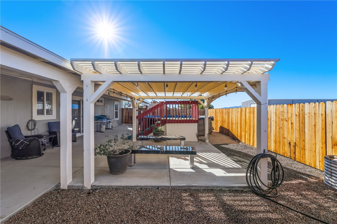 429 South Lochiel Road Golden Valley, AZ 86413 - Photo 39 of 61 Fenced backyard featuring a patio and area for grilling
