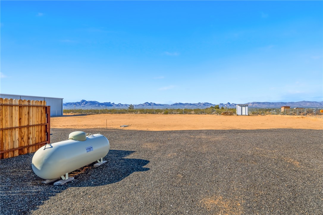 429 South Lochiel Road Golden Valley, AZ 86413 - Photo 44 of 61 View of yard featuring a rural view and a mountain view