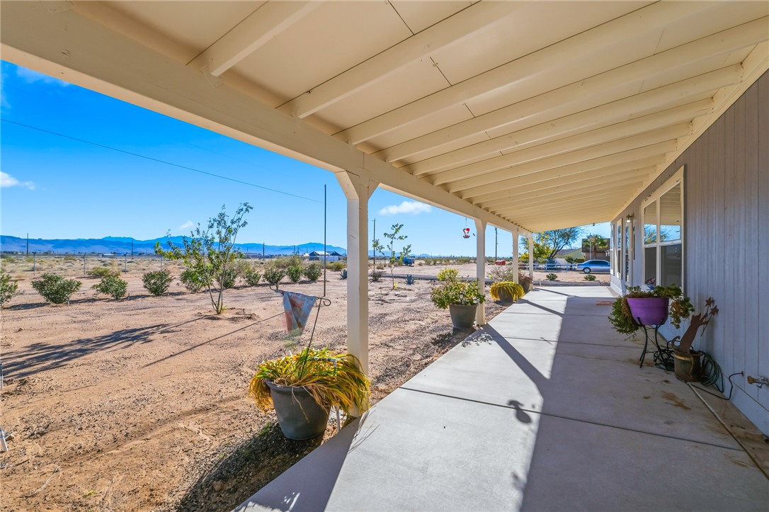 429 South Lochiel Road Golden Valley, AZ 86413 - Photo 9 of 61 View of front patio / terrace with a mountain view and a view of countryside