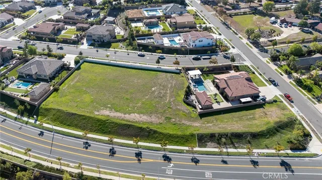 an aerial view of residential houses and outdoor space