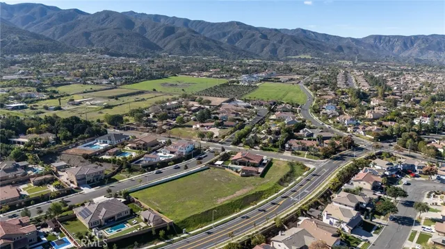 an aerial view of residential houses and outdoor space