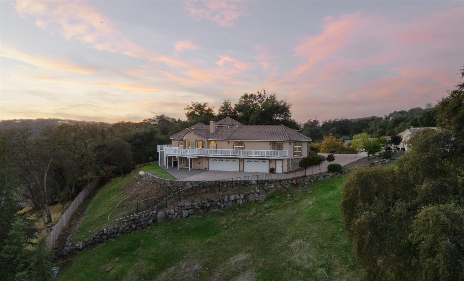 4329 Crazy Horse Road Cameron Park, CA 95682 - Photo 1 of 1 a view of a big house with a big yard and large trees