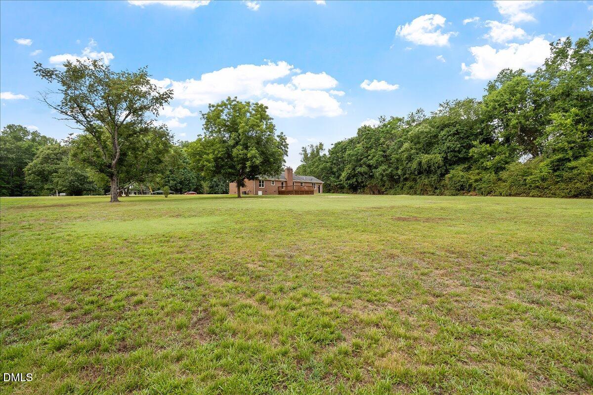 805 Rand Road Garner, NC 27529 - Photo 12 of 38 a view of a field with an trees in the background