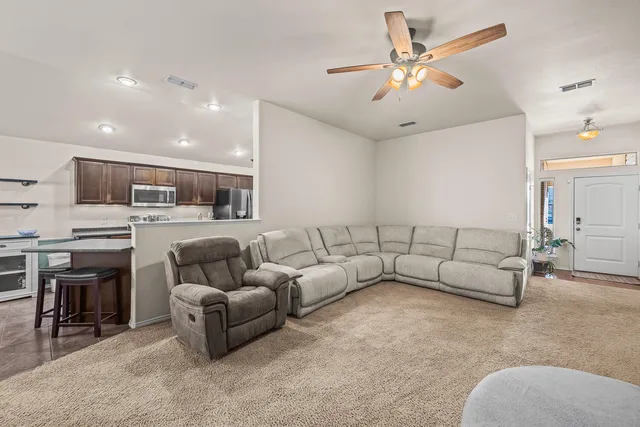a living room with furniture a fireplace