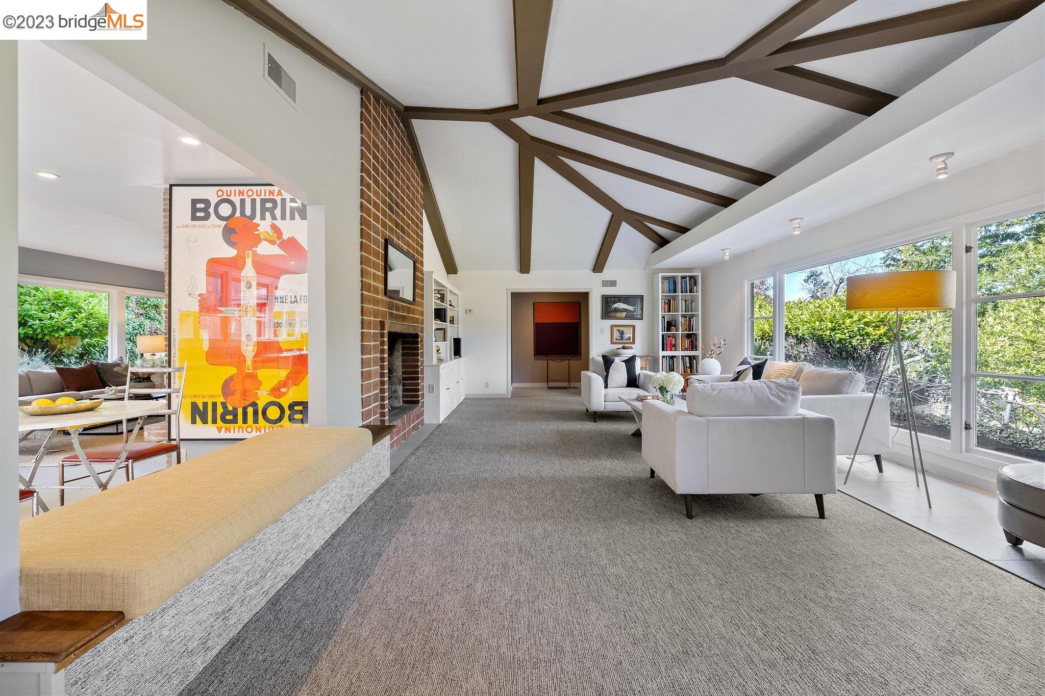 1154 Woodside Road Berkeley, CA 94708 - Photo 1 of 1 a living room with fireplace furniture and a large window