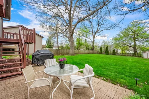 a view of yard with seating area and green space