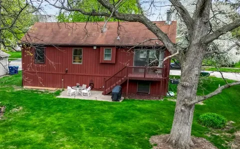 a view of house with backyard and garden