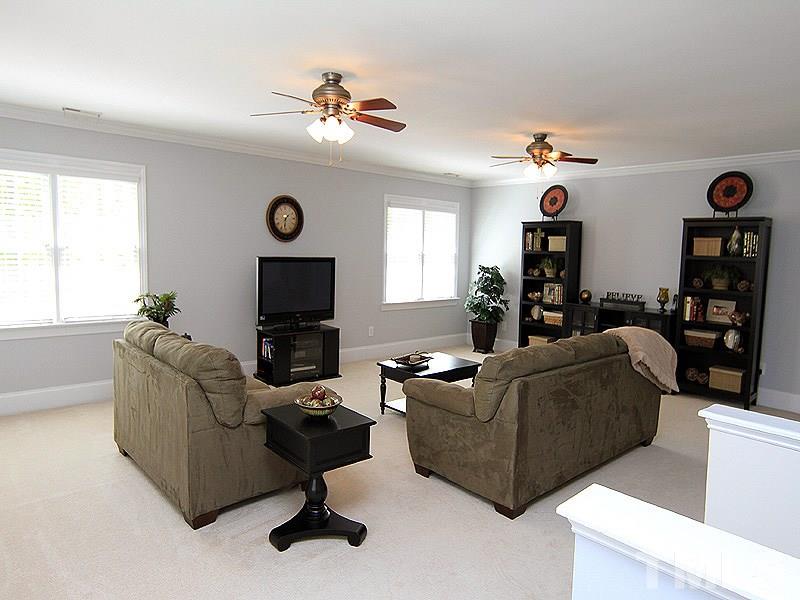 3201 Ringland Road Raleigh, NC 27613 - Photo 14 of 25 a living room with furniture and a flat screen tv