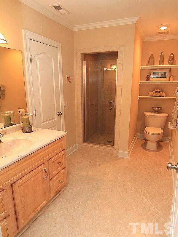 3201 Ringland Road Raleigh, NC 27613 - Photo 18 of 25 a bathroom with a sink and a mirror