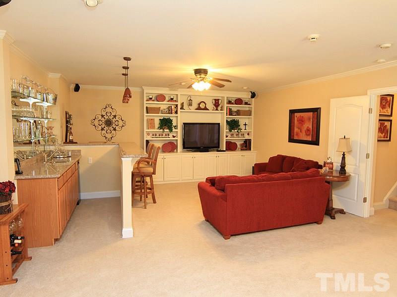 3201 Ringland Road Raleigh, NC 27613 - Photo 20 of 25 a living room with furniture and a flat screen tv