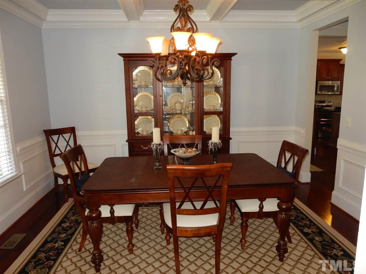 3201 Ringland Road Raleigh, NC 27613 - Photo 3 of 25 a view of a dining room with furniture and wooden floor