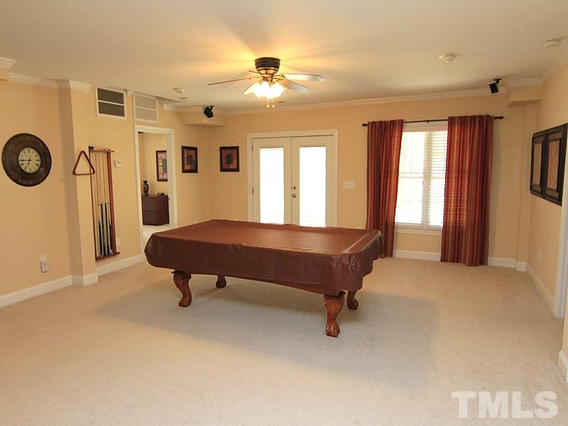 3201 Ringland Road Raleigh, NC 27613 - Photo 23 of 25 a spacious bedroom with a bed and a window
