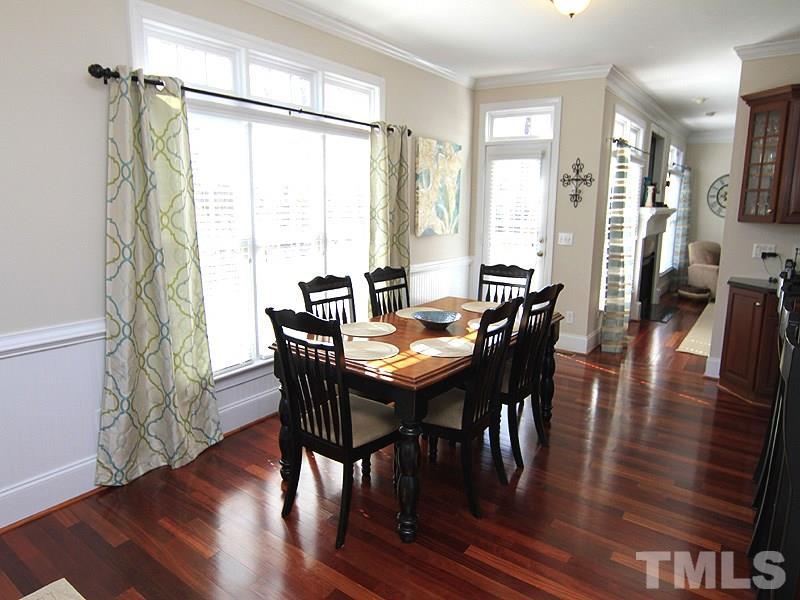 3201 Ringland Road Raleigh, NC 27613 - Photo 10 of 25 a view of a dining room with furniture window and wooden floor