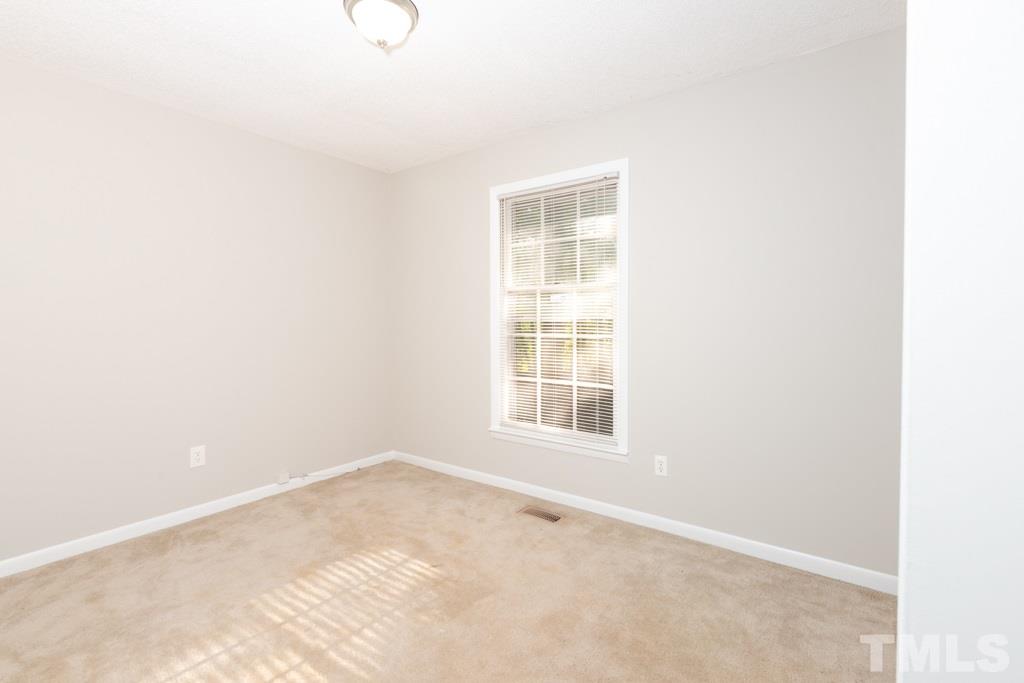 2705 Whitfield Road Chapel Hill, NC 27514 - Photo 11 of 15 an empty room with windows