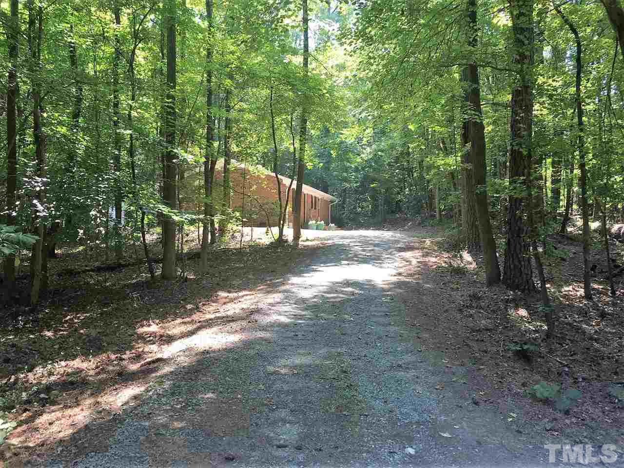 2705 Whitfield Road Chapel Hill, NC 27514 - Photo 15 of 15 a view of a yard with plants and trees