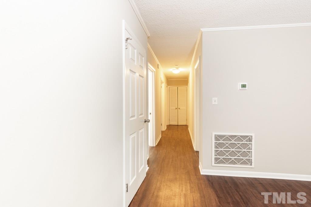 2705 Whitfield Road Chapel Hill, NC 27514 - Photo 7 of 15 a view of a hallway with wooden floor