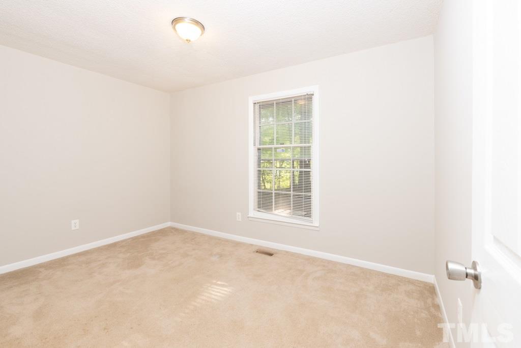 2705 Whitfield Road Chapel Hill, NC 27514 - Photo 10 of 15 an empty room with a empty space and a window