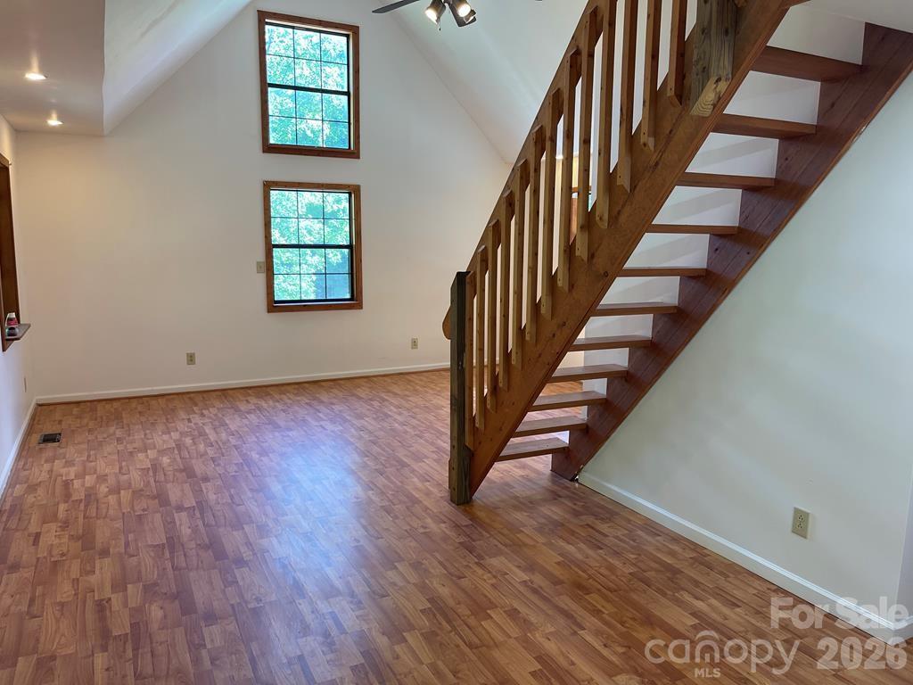 930 Copperhead Cove Road Sylva, NC 28779 - Photo 11 of 18 an entryway in a hall with wooden floor and a window