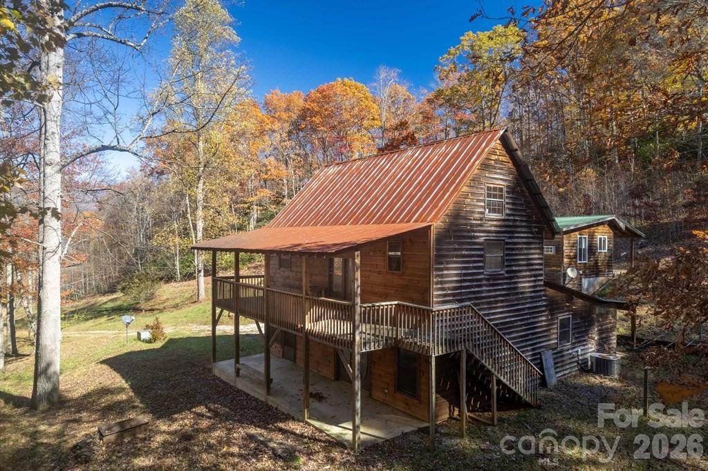 930 Copperhead Cove Road Sylva, NC 28779 - Photo 12 of 18 a view of house with backyard