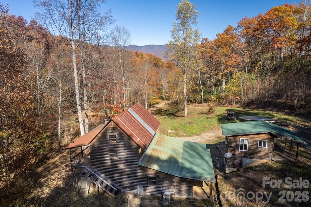 930 Copperhead Cove Road Sylva, NC 28779 - Photo 2 of 18 a view of yard with outdoor seating
