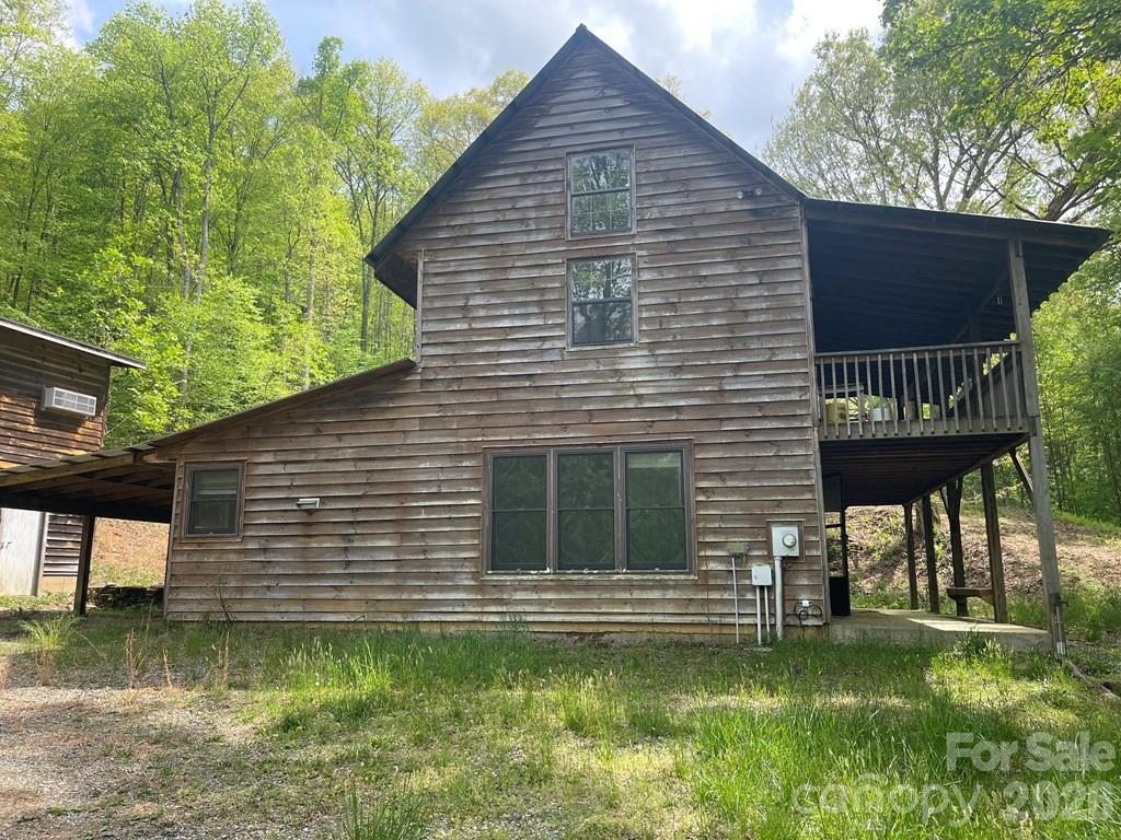 930 Copperhead Cove Road Sylva, NC 28779 - Photo 6 of 18 a view of a backyard with a garden