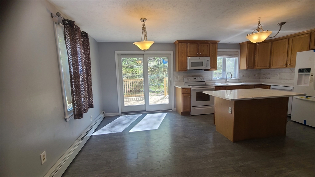56 Cote Road Monson, MA 01057 - Photo 4 of 20 a kitchen with a sink stove and cabinets