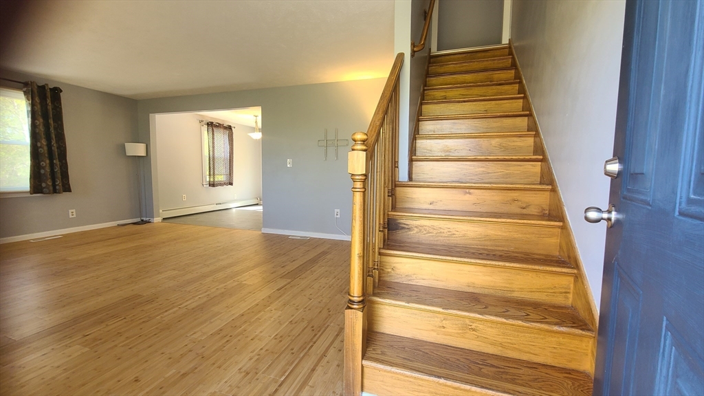 56 Cote Road Monson, MA 01057 - Photo 5 of 20 a view of an entryway with wooden floor and door