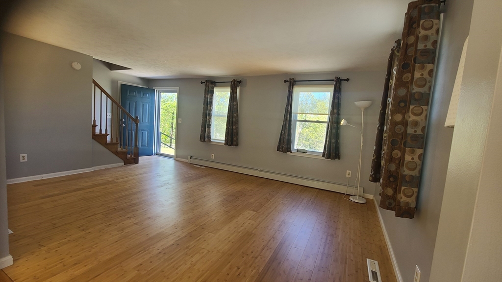 56 Cote Road Monson, MA 01057 - Photo 6 of 20 a view of livingroom with hardwood floor and window