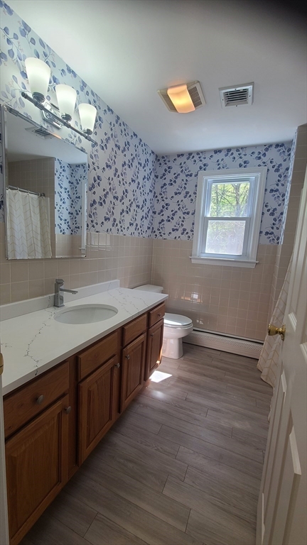 56 Cote Road Monson, MA 01057 - Photo 8 of 20 a bathroom with a sink a vanity and a large mirror