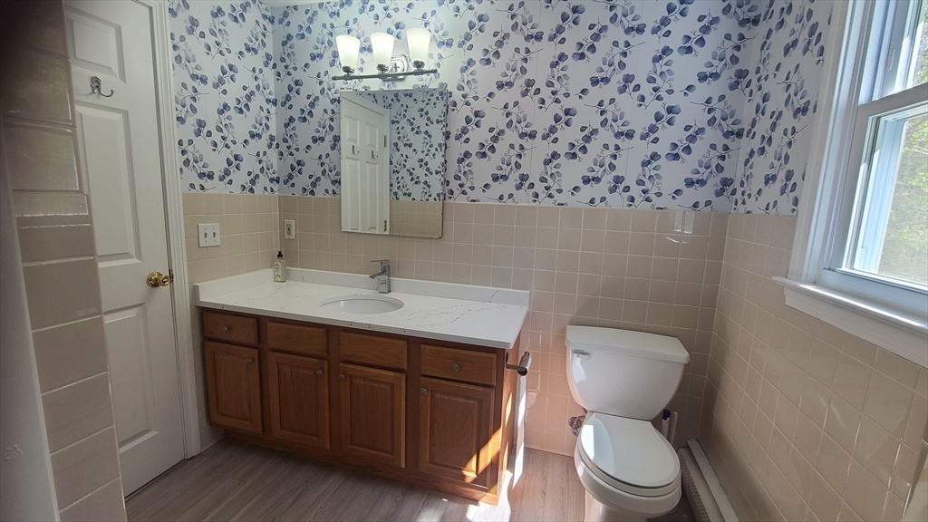 56 Cote Road Monson, MA 01057 - Photo 9 of 20 a bathroom with a toilet sink and mirror
