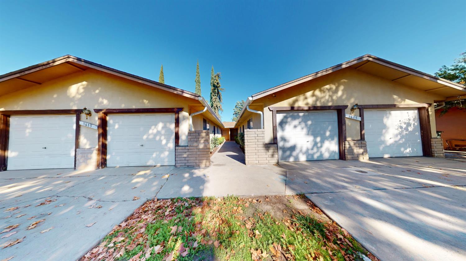 1613 East Rumble Road Modesto, CA 95355 - Photo 1 of 1 a front view of house with yard