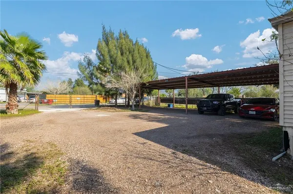 a view of street with parked cars