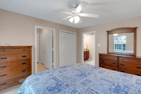 a bedroom with a bed and a dresser