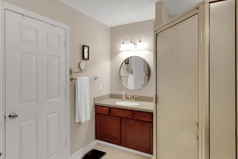 a bathroom with a sink a vanity and a mirror
