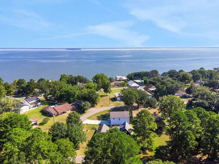 an aerial view of a houses with outdoor space