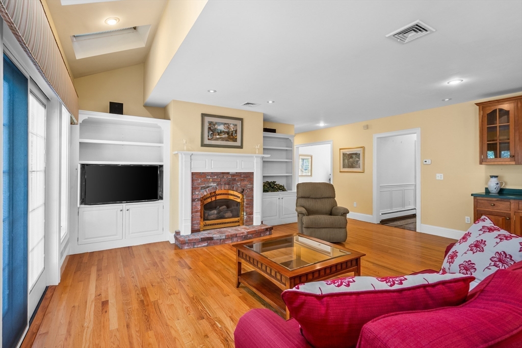6 Match Point Dennis, MA 02638 - Photo 14 of 42 a living room with furniture a flat screen tv and a fireplace