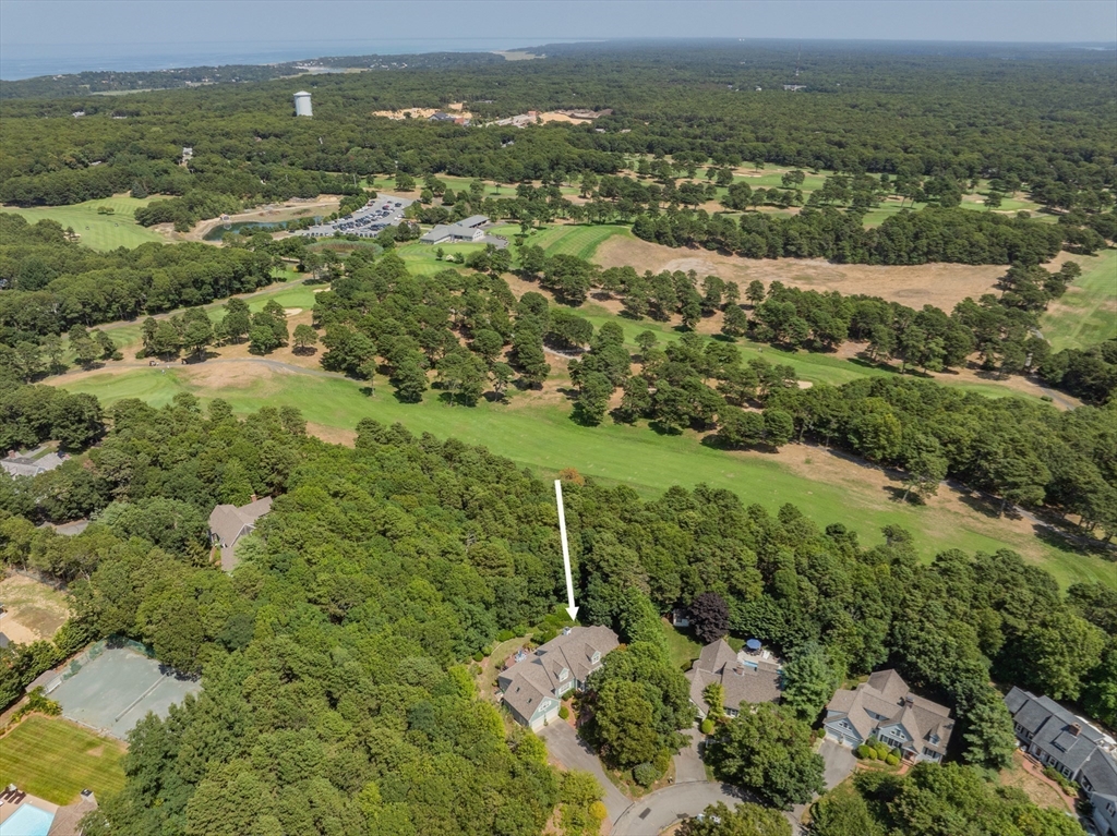 6 Match Point Dennis, MA 02638 - Photo 2 of 42 an aerial view of residential houses with outdoor space and trees