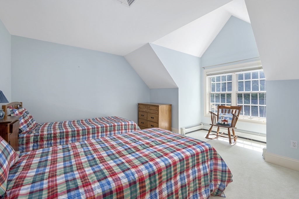 6 Match Point Dennis, MA 02638 - Photo 23 of 42 a bedroom with a bed and wooden floor