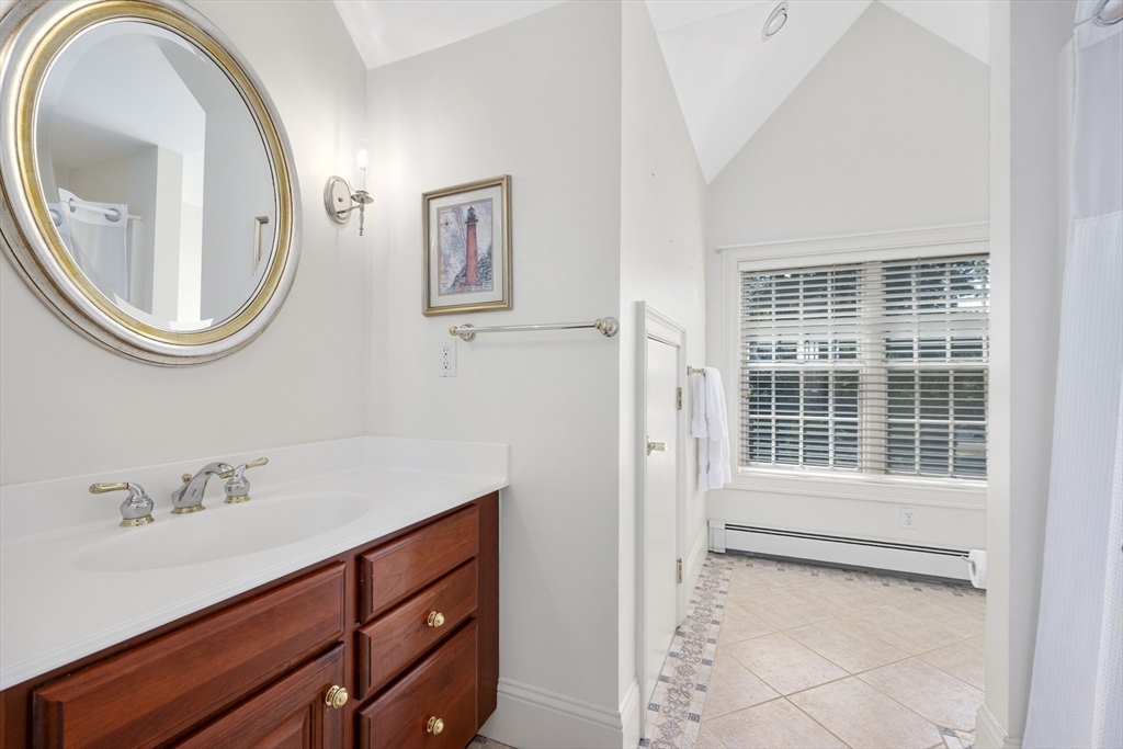 6 Match Point Dennis, MA 02638 - Photo 26 of 42 a bathroom with a sink a mirror and a window